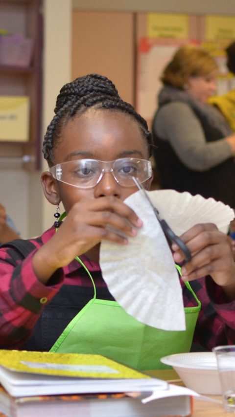 Trinity Wilkins, a fifth-grader at Booker T. Washington Elementary School in Suffolk, Virginia, prepares filter paper to explore the chromatography of candy as part of the BASF Kids’ Lab during National Chemistry Week.