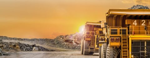 Dump Trucks transporting Platinum ore for processing