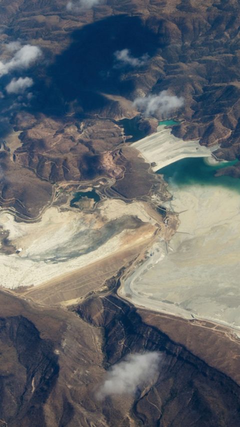 Aerial view of mine tailings from the Bagdad Mine, an open pit copper mine in Bagdad, Arizona, USA. Mine is just off to the left.