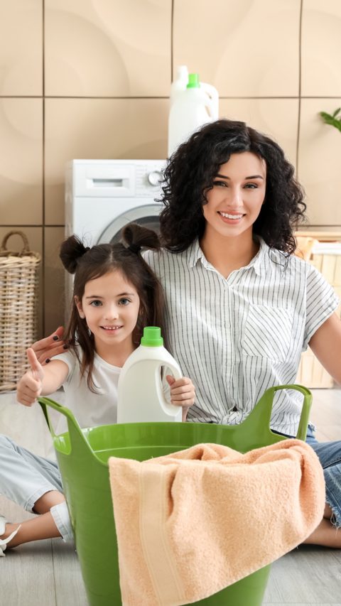 Mother and daughter doing laundry at home; Shutterstock ID 2072273699; purchase_order: Home Care I&I; client: EMD; job: ; other: 