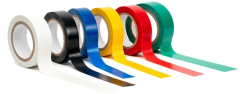 Photo multi colored insulating tapes on a white background.