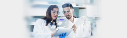 Two people look at the Lab Assistant Tool in the laboratory.jpg