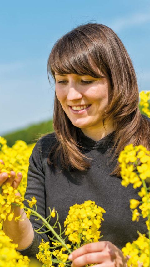 Young female farmer on a field 
