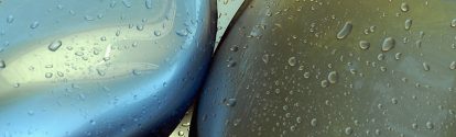 Waterdrops on car shapes coated with a paint that gleams like liquid metal