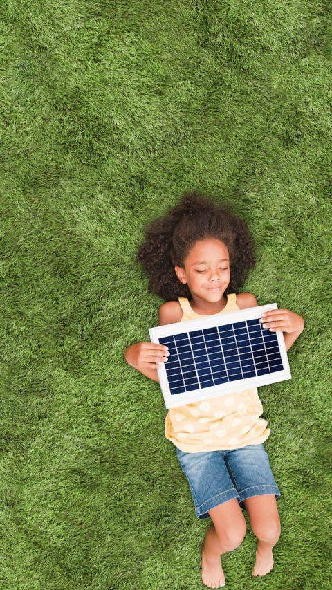 header_energy efficiency_girl_grass_solar protector.jpg