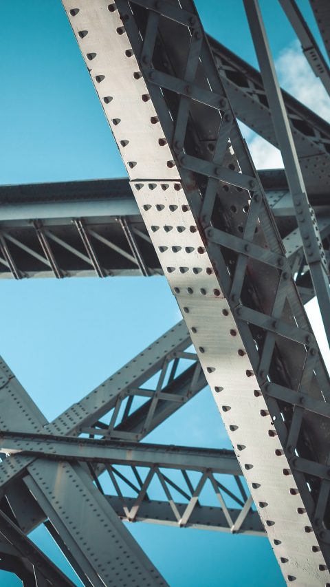 Bridge frame closeup on blue sky background. Horizontal toned image