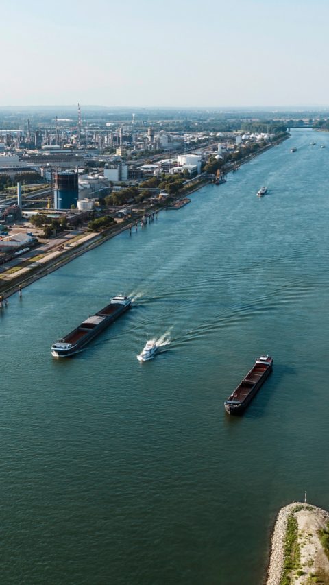 Ships on the river Rhine next to BASF's headquarter in Ludwigshafen, Germany